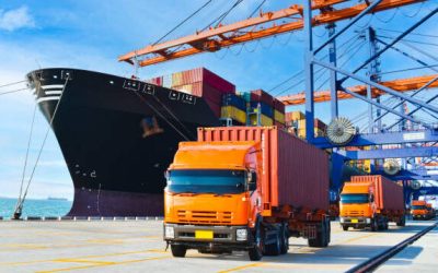 Container shipping, orange color truckload with a container at a harbor. Container port terminal, container delivery.